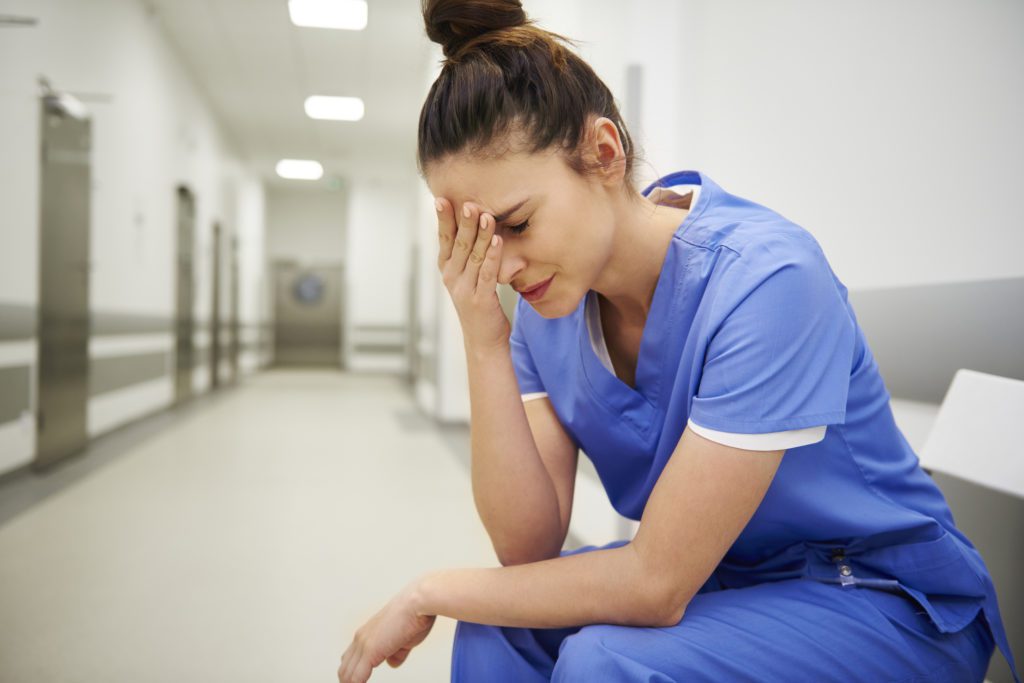 female nurse managing nurse stress
